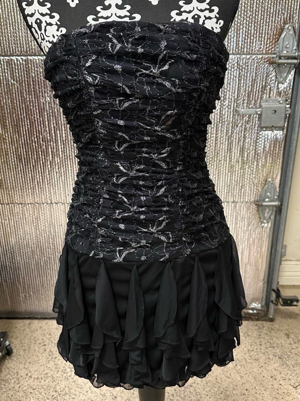 Black lace floral ruffle mini sleeveless dress.